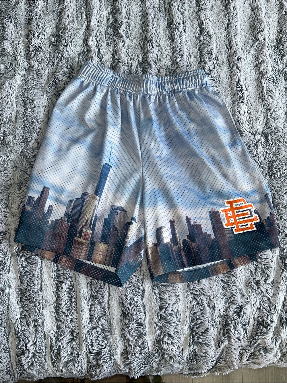 Light Blue Skyline Mesh Athletic Shorts with Orange Logo